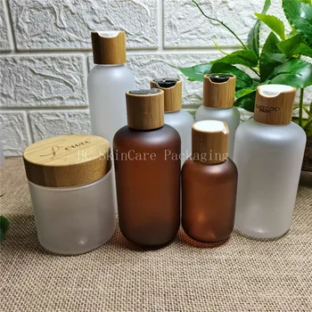 Özel Logo mat amber plastik şişeler disk bambu kapak cilt bakım kremi kavanoz boş şişeler kozmetik kapları toptan